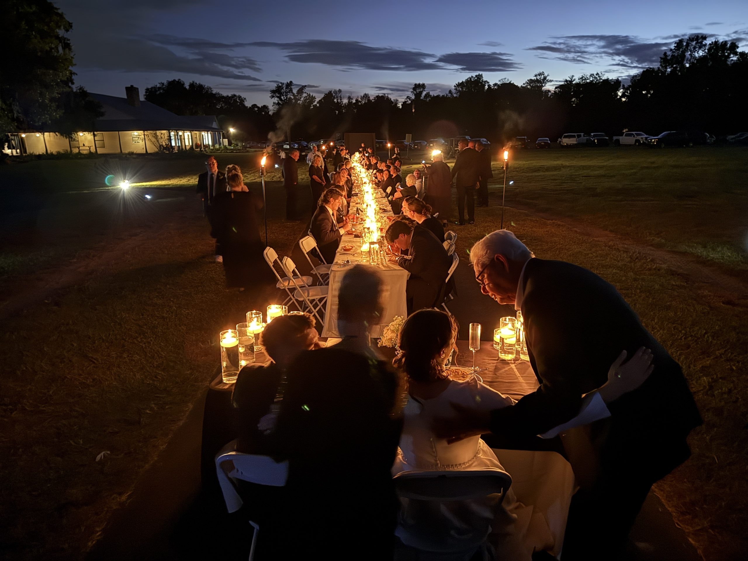 Torchlit reception at The Ranch at night