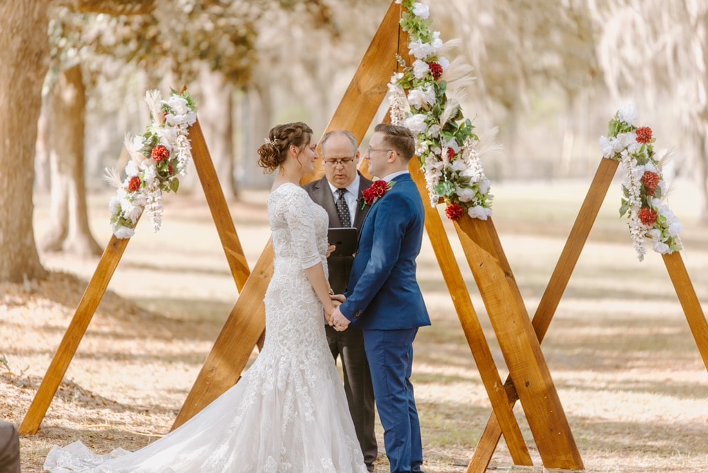Wooden love sign hanging in the oak tree at The Ranch during the Lesage wedding