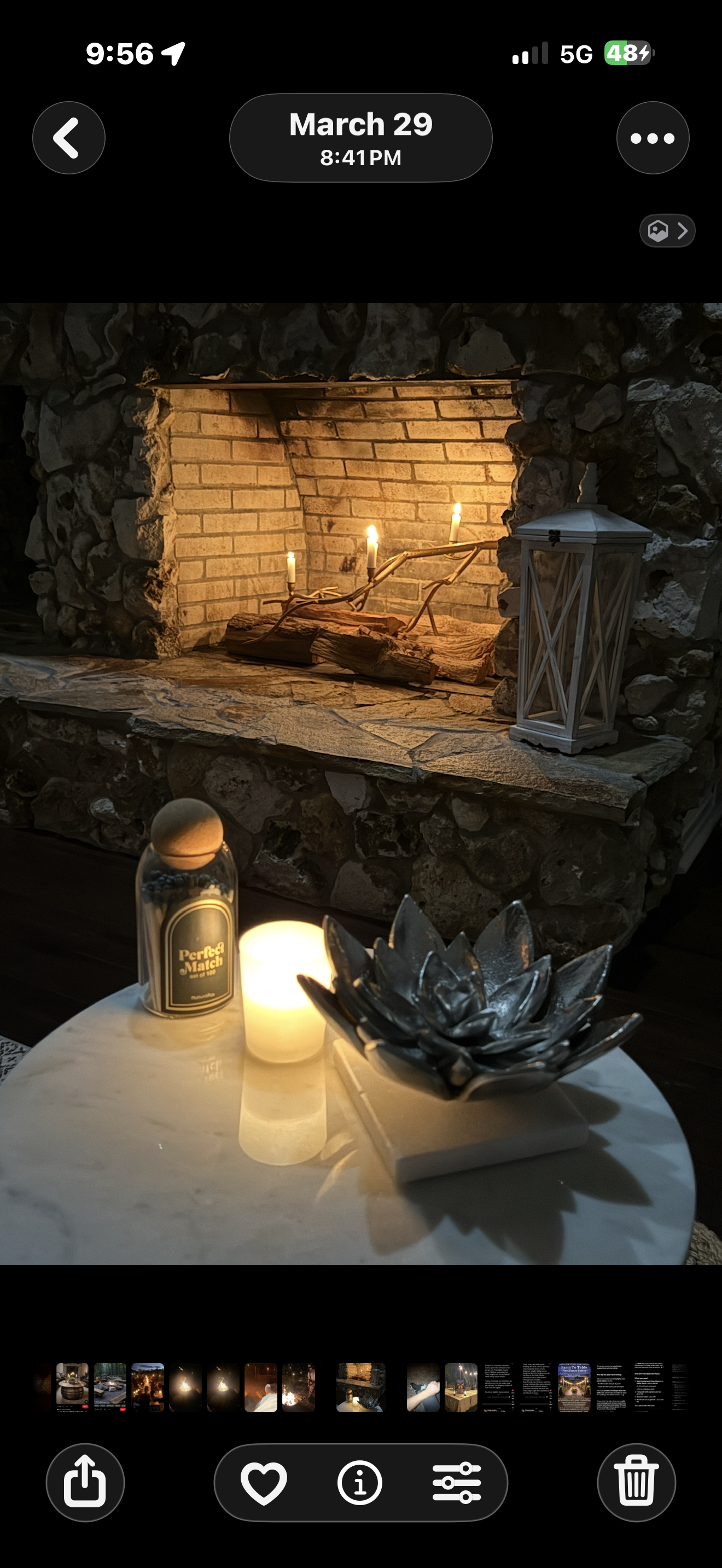 Stone fireplace with candles and lantern at The Ranch at night