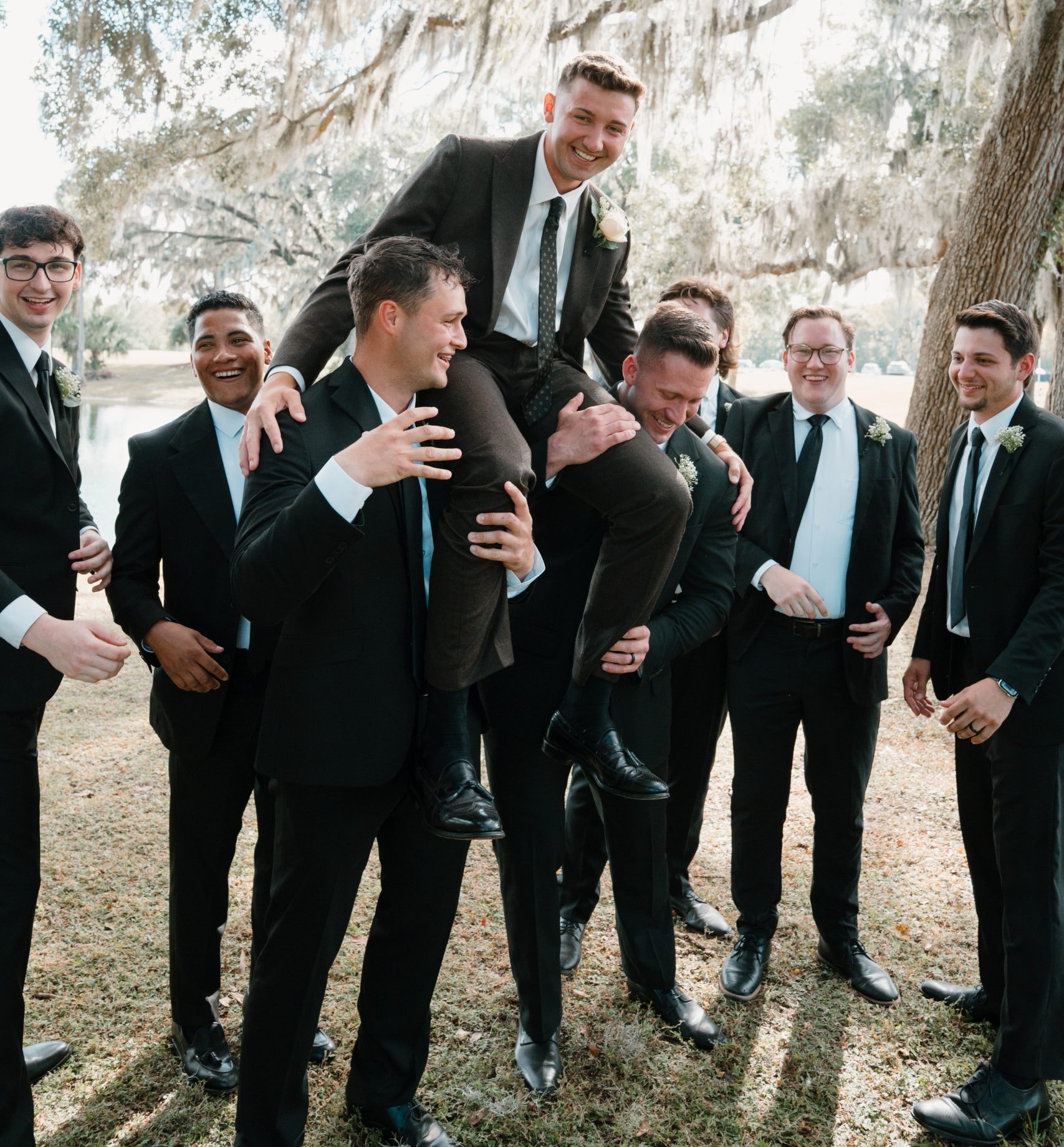 Wedding party celebrating by the lake at The Ranch